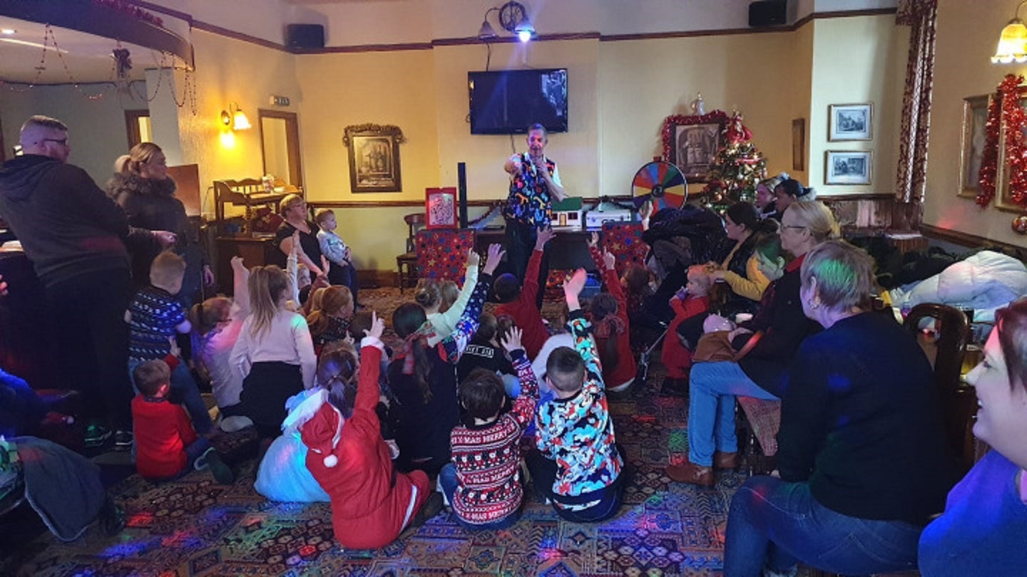 children's entertainer at a party with a magic show
